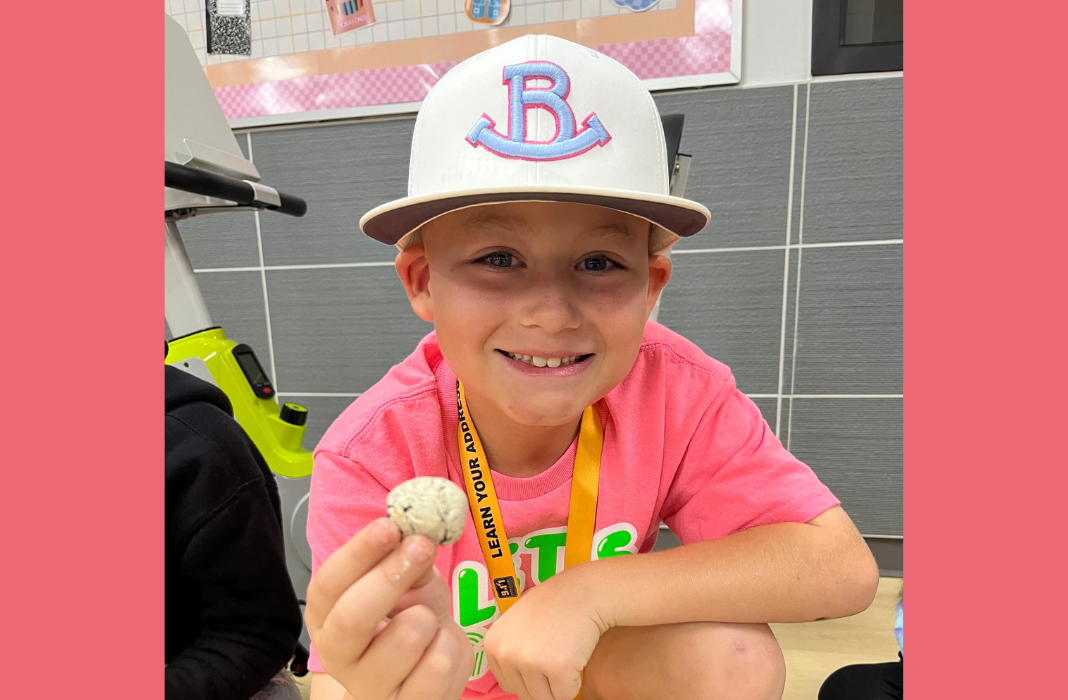  students holding wildflower pearl